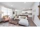 Open-concept living room seamlessly connects to the kitchen, featuring stylish furniture and a vibrant area rug at 1051 Macoun Dr, Westfield, IN 46074