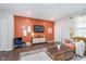 Cozy living room with stylish decor, featuring a modern TV and a comfortable seating area with hardwood floors at 1051 Macoun Dr, Westfield, IN 46074