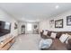 Upstairs living room with a large sectional sofa and cozy carpeting at 1051 Macoun Dr, Westfield, IN 46074