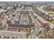 Aerial view of a community of red brick townhomes with private parking areas at 1072 3Rd Nw Ave, Carmel, IN 46032