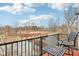View of bridge and trees from balcony with table and chairs at 1072 3Rd Nw Ave, Carmel, IN 46032