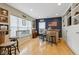 Finished basement with bar, built-in shelving, hardwood floors, and ample seating at 1072 3Rd Nw Ave, Carmel, IN 46032