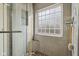 Modern bathroom with a glass-enclosed shower and unique mosaic tile accents for a spa-like feel at 1072 3Rd Nw Ave, Carmel, IN 46032