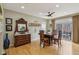Dining room featuring hardwood floors, ceiling fan, and a view of the balcony at 1072 3Rd Nw Ave, Carmel, IN 46032