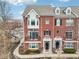 Charming brick townhome featuring a balcony and manicured landscaping at 1072 3Rd Nw Ave, Carmel, IN 46032