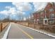 Brick townhomes adjacent to paved walking trails and open green space at 1072 3Rd Nw Ave, Carmel, IN 46032