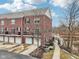 A brick multi-Gathering townhome with multi-car garages and bridge access at 1072 3Rd Nw Ave, Carmel, IN 46032