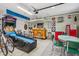 Finished garage space with games, bar, seating and vintage decor at 1072 3Rd Nw Ave, Carmel, IN 46032