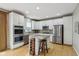 Updated kitchen with stainless steel appliances and center island at 1072 3Rd Nw Ave, Carmel, IN 46032