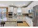 Bright kitchen offers stainless appliances, stone countertops and ample cabinet space at 1072 3Rd Nw Ave, Carmel, IN 46032