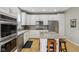 Bright kitchen features white cabinets, stainless steel appliances and granite countertops at 1072 3Rd Nw Ave, Carmel, IN 46032