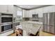 Bright kitchen featuring stainless steel appliances and granite countertops at 1072 3Rd Nw Ave, Carmel, IN 46032