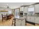 Open concept with kitchen island, granite countertops and stainless steel appliances at 1072 3Rd Nw Ave, Carmel, IN 46032