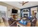 Cozy living room featuring fireplace, hardwood floors, and comfortable seating at 1072 3Rd Nw Ave, Carmel, IN 46032