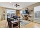 Comfortable living room with hardwood floors, ceiling fan, and stylish decor at 1072 3Rd Nw Ave, Carmel, IN 46032