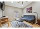 Cozy living room featuring a futon, modern furnishings, and hardwood floors at 1072 3Rd Nw Ave, Carmel, IN 46032