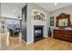 Cozy living room is adjacent to a fireplace, and the dining room at 1072 3Rd Nw Ave, Carmel, IN 46032