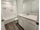 Clean bathroom with a tub/shower combination, white vanity, quartz countertops, and modern fixtures at 11305 N Quillow Way, Monrovia, IN 46157