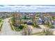 Aerial view of a neighborhood showcasing the home's location and surrounding mature trees at 12205 Whitebark Dr, Indianapolis, IN 46236