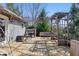 Spacious wooden deck features a grill, dining table, and pergola for outdoor entertaining at 12205 Whitebark Dr, Indianapolis, IN 46236