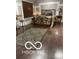 Stylish bedroom boasts a metal bed frame, dark wood floors, an area rug and a window with dark blinds at 12205 Whitebark Dr, Indianapolis, IN 46236