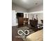 Cozy bedroom features dark wood floors, area rug and traditional wooden furniture at 12205 Whitebark Dr, Indianapolis, IN 46236