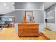 Classic entryway featuring wood trim, hardwood floors, and a decorative display cabinet at 12205 Whitebark Dr, Indianapolis, IN 46236