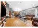 Open-concept living room flows into the kitchen, featuring hardwood floors and ample natural light at 12205 Whitebark Dr, Indianapolis, IN 46236