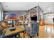 Spacious living room boasting hardwood floors, comfortable seating, statement lighting, and a large bookshelf at 12205 Whitebark Dr, Indianapolis, IN 46236