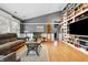 Comfortable living room with stylish furniture, hardwood floors, a cathedral ceiling, and built-in shelving at 12205 Whitebark Dr, Indianapolis, IN 46236