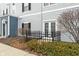 Apartment back door with small black gate at 12863 Tradd St # 1D, Carmel, IN 46032