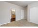 This bedroom includes a closet and a door to the en suite bathroom at 12863 Tradd St # 1D, Carmel, IN 46032