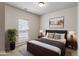 Comfortable bedroom with a large window, neutral paint, and a simple modern design at 12863 Tradd St # 1D, Carmel, IN 46032
