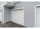 Garage door in a grey multi-Gathering complex at 12863 Tradd St # 1D, Carmel, IN 46032