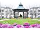 A charming gazebo adorns a town square, with beautiful flower beds and budding trees surrounding it at 12863 Tradd St # 1D, Carmel, IN 46032