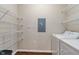 Well-organized laundry room with wire shelving and washer/dryer at 12863 Tradd St # 1D, Carmel, IN 46032