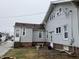 Back exterior of a home featuring a patio and a well-maintained yard at 2025 Main St, Elwood, IN 46036