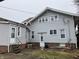 Back exterior of a home featuring a patio and a well-maintained yard at 2025 Main St, Elwood, IN 46036