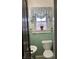 Small bathroom featuring green tile and a cute window treatment at 2025 Main St, Elwood, IN 46036