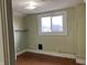 Bedroom with view of neighborhood through the bright window at 2025 Main St, Elwood, IN 46036