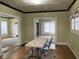 Light and bright dining room with hardwood floors and open floor plan at 2025 Main St, Elwood, IN 46036