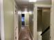 Hallway with wood floors and access to various rooms at 2025 Main St, Elwood, IN 46036