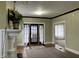 Spacious living room showing fireplace and entry to room at 2025 Main St, Elwood, IN 46036