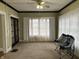 Spacious living room featuring ample windows, a ceiling fan, and a comfortable atmosphere at 2025 Main St, Elwood, IN 46036