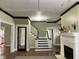 View of living room showing fireplace and staircase at 2025 Main St, Elwood, IN 46036