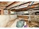 Unfinished basement with concrete block walls, utilities and natural light at 2850 Tansel Rd, Indianapolis, IN 46234