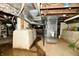 Unfinished basement shows mechanicals, low ceiling, and concrete walls at 2850 Tansel Rd, Indianapolis, IN 46234