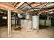 Unfinished basement showing water heater, concrete walls and unfinished ceiling at 2850 Tansel Rd, Indianapolis, IN 46234
