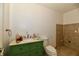 Bathroom with green vanity, tile floors, and toilet at 2850 Tansel Rd, Indianapolis, IN 46234
