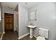 Clean bathroom with a pedestal sink, tiled floors, and a shower/tub combination at 2850 Tansel Rd, Indianapolis, IN 46234